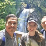 Cruising with Danny and Peter, Holland America Line, Westerdam, Seattle, Washington, United States, Day Trip Waterfalls History | A vibrant collage captures a day in Seattle’s Pacific Northwest Waterfalls Tour, showcasing Pike Place Market’s bustling scene with fishmongers tossing salmon and colorful flower stalls under the iconic red neon sign, set against Puget Sound’s waterfront; Twin Falls cascading over mossy cliffs into a misty pool, surrounded by old-growth evergreens in Olallie State Park, with sunlight filtering through the canopy; North Bend’s retro Twin Peaks diner with its glowing neon sign and quaint main street, framed by rolling hills and the Cascade Mountains; the majestic 270-foot Snoqualmie Falls roaring into a misty pool, with rainbows shimmering in the sunlight and a wooden viewing platform overlooking the lush Snoqualmie Valley; Snoqualmie’s historic district, featuring the Northwest Railway Museum’s vintage locomotives and charming shops lined with old-fashioned street lamps; Borst Lake’s serene waters reflecting Mount Si’s snow-capped peak, with a heron at the edge and evergreen forests under a soft morning mist; and the Museum of Flight’s sleek Concorde and Air Force One jets displayed in a spacious hangar, alongside interactive simulators and a replica of the International Space Station, showcasing Seattle’s aviation heritage.