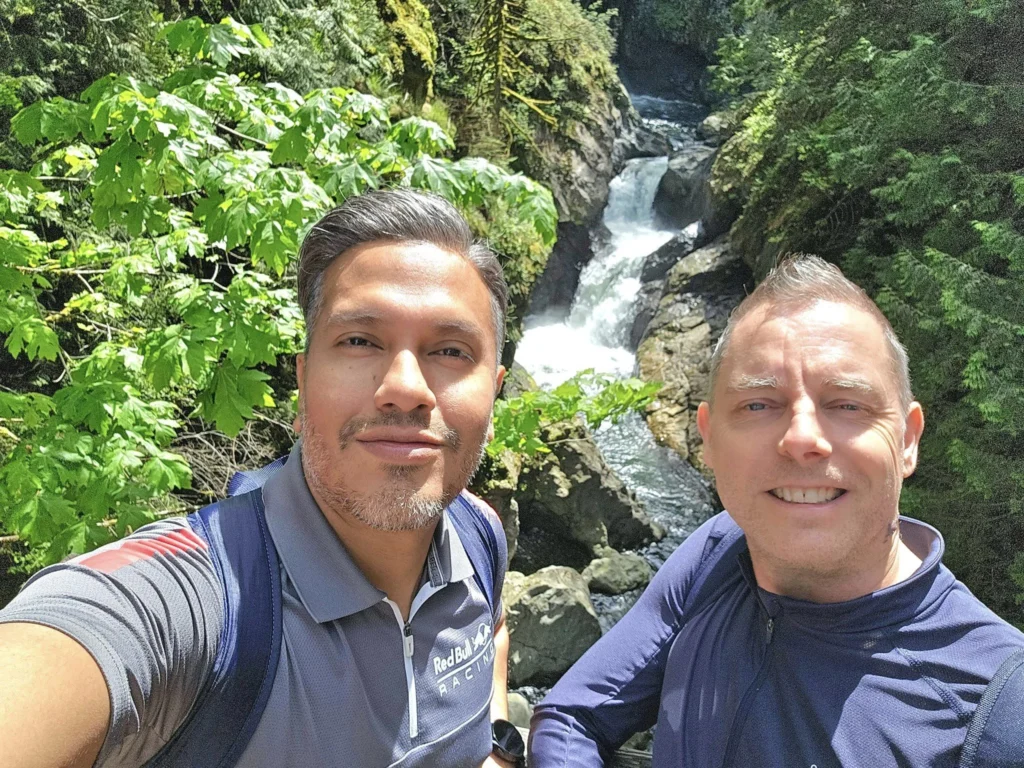Cruising with Danny and Peter, Holland America Line, Westerdam, Seattle, Washington, United States, Day Trip Waterfalls History | A vibrant collage captures a day in Seattle’s Pacific Northwest Waterfalls Tour, showcasing Pike Place Market’s bustling scene with fishmongers tossing salmon and colorful flower stalls under the iconic red neon sign, set against Puget Sound’s waterfront; Twin Falls cascading over mossy cliffs into a misty pool, surrounded by old-growth evergreens in Olallie State Park, with sunlight filtering through the canopy; North Bend’s retro Twin Peaks diner with its glowing neon sign and quaint main street, framed by rolling hills and the Cascade Mountains; the majestic 270-foot Snoqualmie Falls roaring into a misty pool, with rainbows shimmering in the sunlight and a wooden viewing platform overlooking the lush Snoqualmie Valley; Snoqualmie’s historic district, featuring the Northwest Railway Museum’s vintage locomotives and charming shops lined with old-fashioned street lamps; Borst Lake’s serene waters reflecting Mount Si’s snow-capped peak, with a heron at the edge and evergreen forests under a soft morning mist; and the Museum of Flight’s sleek Concorde and Air Force One jets displayed in a spacious hangar, alongside interactive simulators and a replica of the International Space Station, showcasing Seattle’s aviation heritage.