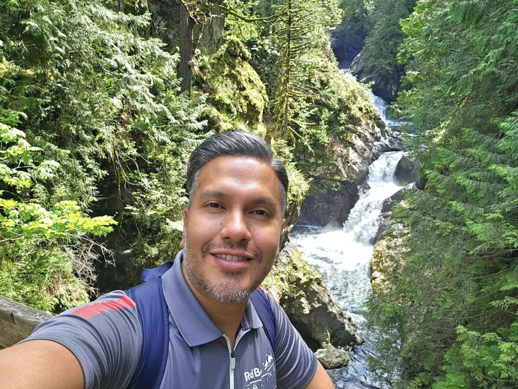 Cruising with Danny and Peter, Holland America Line, Westerdam, Seattle, Washington, United States, Day Trip Waterfalls History | A vibrant collage captures a day in Seattle’s Pacific Northwest Waterfalls Tour, showcasing Pike Place Market’s bustling scene with fishmongers tossing salmon and colorful flower stalls under the iconic red neon sign, set against Puget Sound’s waterfront; Twin Falls cascading over mossy cliffs into a misty pool, surrounded by old-growth evergreens in Olallie State Park, with sunlight filtering through the canopy; North Bend’s retro Twin Peaks diner with its glowing neon sign and quaint main street, framed by rolling hills and the Cascade Mountains; the majestic 270-foot Snoqualmie Falls roaring into a misty pool, with rainbows shimmering in the sunlight and a wooden viewing platform overlooking the lush Snoqualmie Valley; Snoqualmie’s historic district, featuring the Northwest Railway Museum’s vintage locomotives and charming shops lined with old-fashioned street lamps; Borst Lake’s serene waters reflecting Mount Si’s snow-capped peak, with a heron at the edge and evergreen forests under a soft morning mist; and the Museum of Flight’s sleek Concorde and Air Force One jets displayed in a spacious hangar, alongside interactive simulators and a replica of the International Space Station, showcasing Seattle’s aviation heritage.