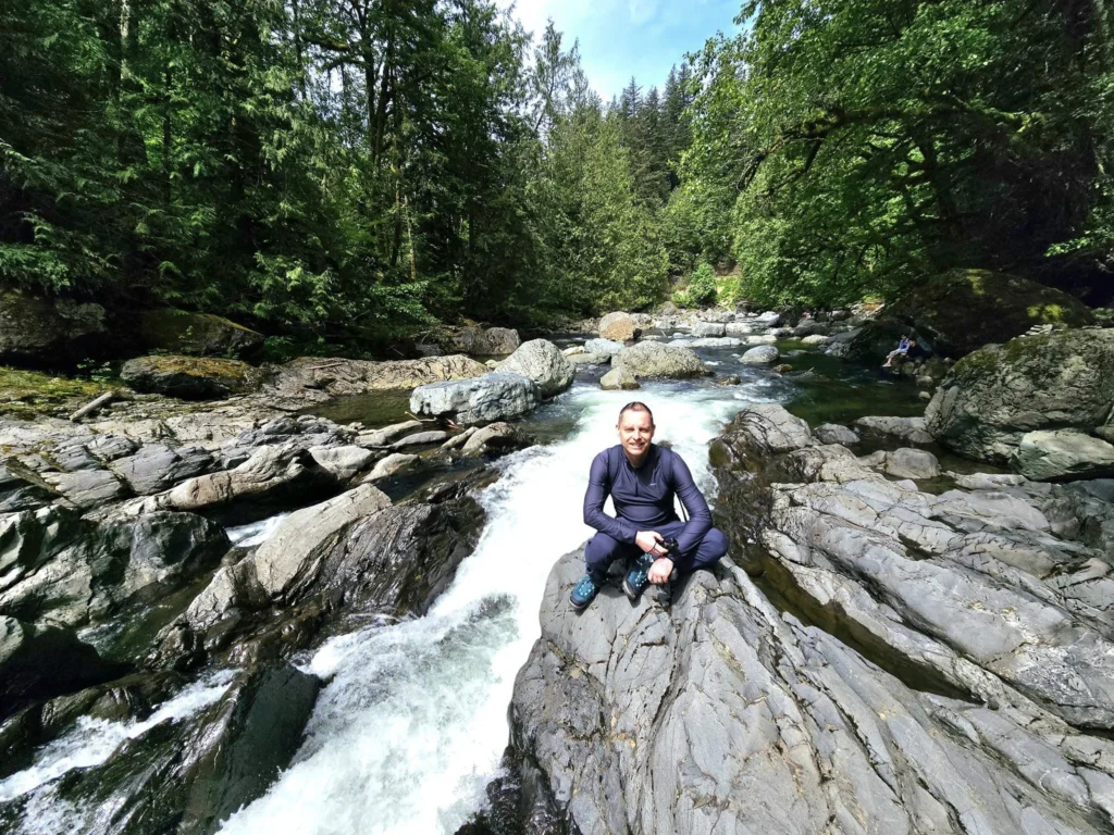 Cruising with Danny and Peter, Holland America Line, Westerdam, Seattle, Washington, United States, Day Trip Waterfalls History | A vibrant collage captures a day in Seattle’s Pacific Northwest Waterfalls Tour, showcasing Pike Place Market’s bustling scene with fishmongers tossing salmon and colorful flower stalls under the iconic red neon sign, set against Puget Sound’s waterfront; Twin Falls cascading over mossy cliffs into a misty pool, surrounded by old-growth evergreens in Olallie State Park, with sunlight filtering through the canopy; North Bend’s retro Twin Peaks diner with its glowing neon sign and quaint main street, framed by rolling hills and the Cascade Mountains; the majestic 270-foot Snoqualmie Falls roaring into a misty pool, with rainbows shimmering in the sunlight and a wooden viewing platform overlooking the lush Snoqualmie Valley; Snoqualmie’s historic district, featuring the Northwest Railway Museum’s vintage locomotives and charming shops lined with old-fashioned street lamps; Borst Lake’s serene waters reflecting Mount Si’s snow-capped peak, with a heron at the edge and evergreen forests under a soft morning mist; and the Museum of Flight’s sleek Concorde and Air Force One jets displayed in a spacious hangar, alongside interactive simulators and a replica of the International Space Station, showcasing Seattle’s aviation heritage.