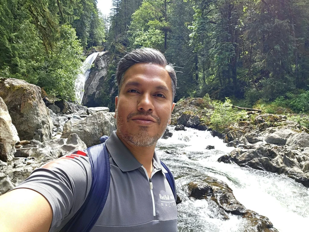 Cruising with Danny and Peter, Holland America Line, Westerdam, Seattle, Washington, United States, Day Trip Waterfalls History | A vibrant collage captures a day in Seattle’s Pacific Northwest Waterfalls Tour, showcasing Pike Place Market’s bustling scene with fishmongers tossing salmon and colorful flower stalls under the iconic red neon sign, set against Puget Sound’s waterfront; Twin Falls cascading over mossy cliffs into a misty pool, surrounded by old-growth evergreens in Olallie State Park, with sunlight filtering through the canopy; North Bend’s retro Twin Peaks diner with its glowing neon sign and quaint main street, framed by rolling hills and the Cascade Mountains; the majestic 270-foot Snoqualmie Falls roaring into a misty pool, with rainbows shimmering in the sunlight and a wooden viewing platform overlooking the lush Snoqualmie Valley; Snoqualmie’s historic district, featuring the Northwest Railway Museum’s vintage locomotives and charming shops lined with old-fashioned street lamps; Borst Lake’s serene waters reflecting Mount Si’s snow-capped peak, with a heron at the edge and evergreen forests under a soft morning mist; and the Museum of Flight’s sleek Concorde and Air Force One jets displayed in a spacious hangar, alongside interactive simulators and a replica of the International Space Station, showcasing Seattle’s aviation heritage.