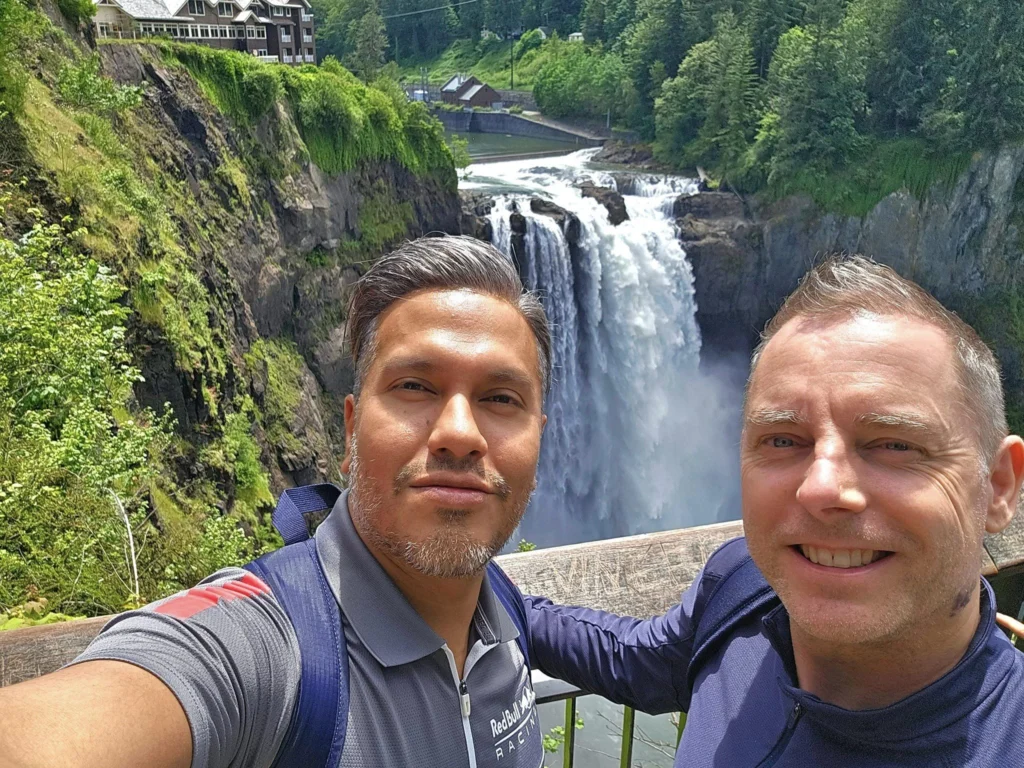 Cruising with Danny and Peter, Holland America Line, Westerdam, Seattle, Washington, United States, Day Trip Waterfalls History | A vibrant collage captures a day in Seattle’s Pacific Northwest Waterfalls Tour, showcasing Pike Place Market’s bustling scene with fishmongers tossing salmon and colorful flower stalls under the iconic red neon sign, set against Puget Sound’s waterfront; Twin Falls cascading over mossy cliffs into a misty pool, surrounded by old-growth evergreens in Olallie State Park, with sunlight filtering through the canopy; North Bend’s retro Twin Peaks diner with its glowing neon sign and quaint main street, framed by rolling hills and the Cascade Mountains; the majestic 270-foot Snoqualmie Falls roaring into a misty pool, with rainbows shimmering in the sunlight and a wooden viewing platform overlooking the lush Snoqualmie Valley; Snoqualmie’s historic district, featuring the Northwest Railway Museum’s vintage locomotives and charming shops lined with old-fashioned street lamps; Borst Lake’s serene waters reflecting Mount Si’s snow-capped peak, with a heron at the edge and evergreen forests under a soft morning mist; and the Museum of Flight’s sleek Concorde and Air Force One jets displayed in a spacious hangar, alongside interactive simulators and a replica of the International Space Station, showcasing Seattle’s aviation heritage.
