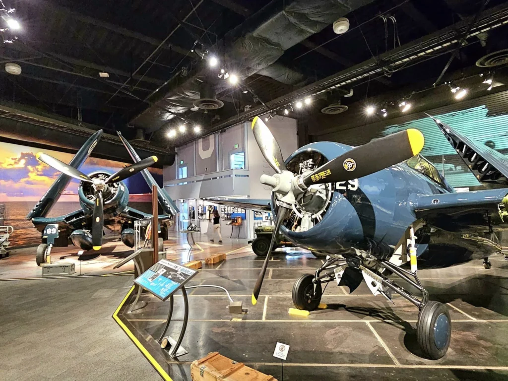 Cruising with Danny and Peter, Holland America Line, Westerdam, Seattle, Washington, United States, Day Trip Waterfalls History | A vibrant collage captures a day in Seattle’s Pacific Northwest Waterfalls Tour, showcasing Pike Place Market’s bustling scene with fishmongers tossing salmon and colorful flower stalls under the iconic red neon sign, set against Puget Sound’s waterfront; Twin Falls cascading over mossy cliffs into a misty pool, surrounded by old-growth evergreens in Olallie State Park, with sunlight filtering through the canopy; North Bend’s retro Twin Peaks diner with its glowing neon sign and quaint main street, framed by rolling hills and the Cascade Mountains; the majestic 270-foot Snoqualmie Falls roaring into a misty pool, with rainbows shimmering in the sunlight and a wooden viewing platform overlooking the lush Snoqualmie Valley; Snoqualmie’s historic district, featuring the Northwest Railway Museum’s vintage locomotives and charming shops lined with old-fashioned street lamps; Borst Lake’s serene waters reflecting Mount Si’s snow-capped peak, with a heron at the edge and evergreen forests under a soft morning mist; and the Museum of Flight’s sleek Concorde and Air Force One jets displayed in a spacious hangar, alongside interactive simulators and a replica of the International Space Station, showcasing Seattle’s aviation heritage.