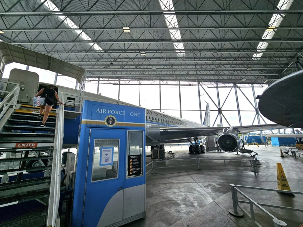 Cruising with Danny and Peter, Holland America Line, Westerdam, Seattle, Washington, United States, Day Trip Waterfalls History | A vibrant collage captures a day in Seattle’s Pacific Northwest Waterfalls Tour, showcasing Pike Place Market’s bustling scene with fishmongers tossing salmon and colorful flower stalls under the iconic red neon sign, set against Puget Sound’s waterfront; Twin Falls cascading over mossy cliffs into a misty pool, surrounded by old-growth evergreens in Olallie State Park, with sunlight filtering through the canopy; North Bend’s retro Twin Peaks diner with its glowing neon sign and quaint main street, framed by rolling hills and the Cascade Mountains; the majestic 270-foot Snoqualmie Falls roaring into a misty pool, with rainbows shimmering in the sunlight and a wooden viewing platform overlooking the lush Snoqualmie Valley; Snoqualmie’s historic district, featuring the Northwest Railway Museum’s vintage locomotives and charming shops lined with old-fashioned street lamps; Borst Lake’s serene waters reflecting Mount Si’s snow-capped peak, with a heron at the edge and evergreen forests under a soft morning mist; and the Museum of Flight’s sleek Concorde and Air Force One jets displayed in a spacious hangar, alongside interactive simulators and a replica of the International Space Station, showcasing Seattle’s aviation heritage.