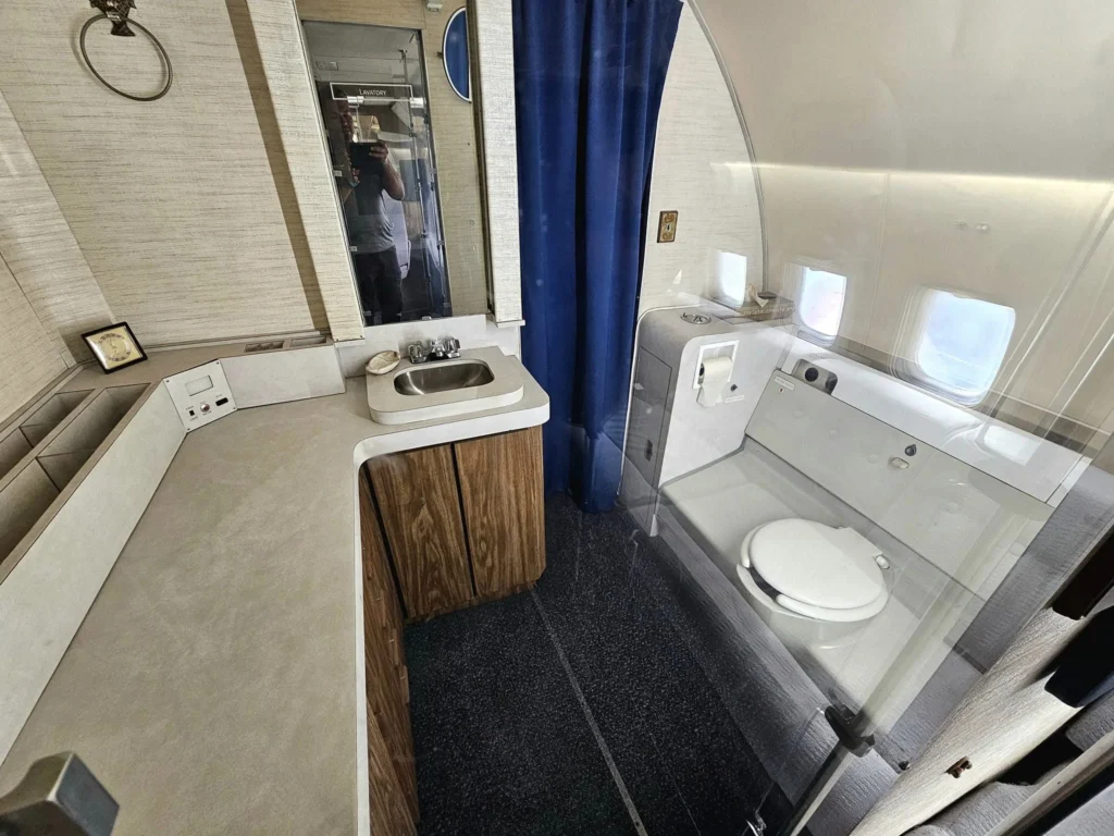 Cruising with Danny and Peter, Holland America Line, Westerdam, Seattle, Washington, United States, Day Trip Waterfalls History | A vibrant collage captures a day in Seattle’s Pacific Northwest Waterfalls Tour, showcasing Pike Place Market’s bustling scene with fishmongers tossing salmon and colorful flower stalls under the iconic red neon sign, set against Puget Sound’s waterfront; Twin Falls cascading over mossy cliffs into a misty pool, surrounded by old-growth evergreens in Olallie State Park, with sunlight filtering through the canopy; North Bend’s retro Twin Peaks diner with its glowing neon sign and quaint main street, framed by rolling hills and the Cascade Mountains; the majestic 270-foot Snoqualmie Falls roaring into a misty pool, with rainbows shimmering in the sunlight and a wooden viewing platform overlooking the lush Snoqualmie Valley; Snoqualmie’s historic district, featuring the Northwest Railway Museum’s vintage locomotives and charming shops lined with old-fashioned street lamps; Borst Lake’s serene waters reflecting Mount Si’s snow-capped peak, with a heron at the edge and evergreen forests under a soft morning mist; and the Museum of Flight’s sleek Concorde and Air Force One jets displayed in a spacious hangar, alongside interactive simulators and a replica of the International Space Station, showcasing Seattle’s aviation heritage.