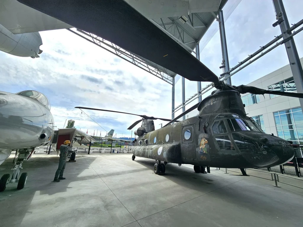 Cruising with Danny and Peter, Holland America Line, Westerdam, Seattle, Washington, United States, Day Trip Waterfalls History | A vibrant collage captures a day in Seattle’s Pacific Northwest Waterfalls Tour, showcasing Pike Place Market’s bustling scene with fishmongers tossing salmon and colorful flower stalls under the iconic red neon sign, set against Puget Sound’s waterfront; Twin Falls cascading over mossy cliffs into a misty pool, surrounded by old-growth evergreens in Olallie State Park, with sunlight filtering through the canopy; North Bend’s retro Twin Peaks diner with its glowing neon sign and quaint main street, framed by rolling hills and the Cascade Mountains; the majestic 270-foot Snoqualmie Falls roaring into a misty pool, with rainbows shimmering in the sunlight and a wooden viewing platform overlooking the lush Snoqualmie Valley; Snoqualmie’s historic district, featuring the Northwest Railway Museum’s vintage locomotives and charming shops lined with old-fashioned street lamps; Borst Lake’s serene waters reflecting Mount Si’s snow-capped peak, with a heron at the edge and evergreen forests under a soft morning mist; and the Museum of Flight’s sleek Concorde and Air Force One jets displayed in a spacious hangar, alongside interactive simulators and a replica of the International Space Station, showcasing Seattle’s aviation heritage.