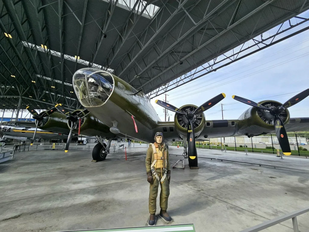 Cruising with Danny and Peter, Holland America Line, Westerdam, Seattle, Washington, United States, Day Trip Waterfalls History | A vibrant collage captures a day in Seattle’s Pacific Northwest Waterfalls Tour, showcasing Pike Place Market’s bustling scene with fishmongers tossing salmon and colorful flower stalls under the iconic red neon sign, set against Puget Sound’s waterfront; Twin Falls cascading over mossy cliffs into a misty pool, surrounded by old-growth evergreens in Olallie State Park, with sunlight filtering through the canopy; North Bend’s retro Twin Peaks diner with its glowing neon sign and quaint main street, framed by rolling hills and the Cascade Mountains; the majestic 270-foot Snoqualmie Falls roaring into a misty pool, with rainbows shimmering in the sunlight and a wooden viewing platform overlooking the lush Snoqualmie Valley; Snoqualmie’s historic district, featuring the Northwest Railway Museum’s vintage locomotives and charming shops lined with old-fashioned street lamps; Borst Lake’s serene waters reflecting Mount Si’s snow-capped peak, with a heron at the edge and evergreen forests under a soft morning mist; and the Museum of Flight’s sleek Concorde and Air Force One jets displayed in a spacious hangar, alongside interactive simulators and a replica of the International Space Station, showcasing Seattle’s aviation heritage.