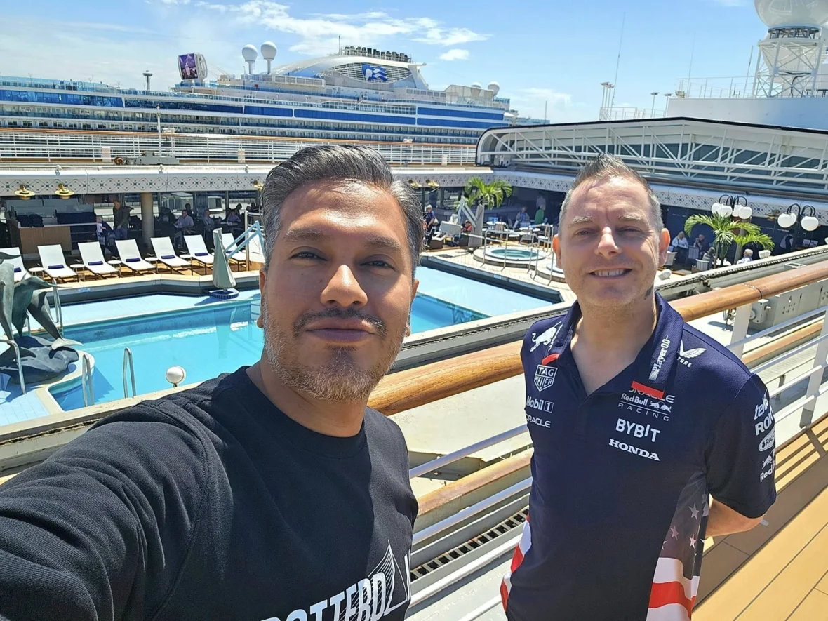 Cruising with Danny and Peter, Holland America Line, Westerdam, Seattle, Washington, United States, Alaska Solstice Cruise | A vibrant scene captures the Holland America Line’s Westerdam docked at Pier 91 in Seattle, Washington, with the iconic Space Needle and bustling Pike Place Market visible in the background, ready for the 28-Day Alaska Arctic Circle Solstice Cruise. The image showcases passengers excitedly boarding the ship, the luxurious stateroom with a spacious balcony offering stunning views of Elliott Bay, and the vessel setting sail from Seattle, marking the start of an unforgettable Alaskan adventure.