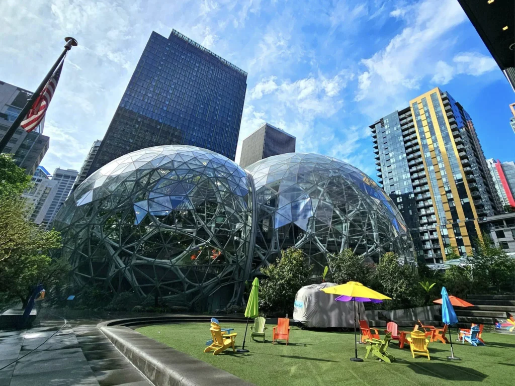Cruising with Danny and Peter, Holland America Line, Westerdam, Seattle, Washington, United States, Alaska Solstice Cruise | A vibrant scene captures the Holland America Line’s Westerdam docked at Pier 91 in Seattle, Washington, with the iconic Space Needle and bustling Pike Place Market visible in the background, ready for the 28-Day Alaska Arctic Circle Solstice Cruise. The image showcases passengers excitedly boarding the ship, the luxurious stateroom with a spacious balcony offering stunning views of Elliott Bay, and the vessel setting sail from Seattle, marking the start of an unforgettable Alaskan adventure.