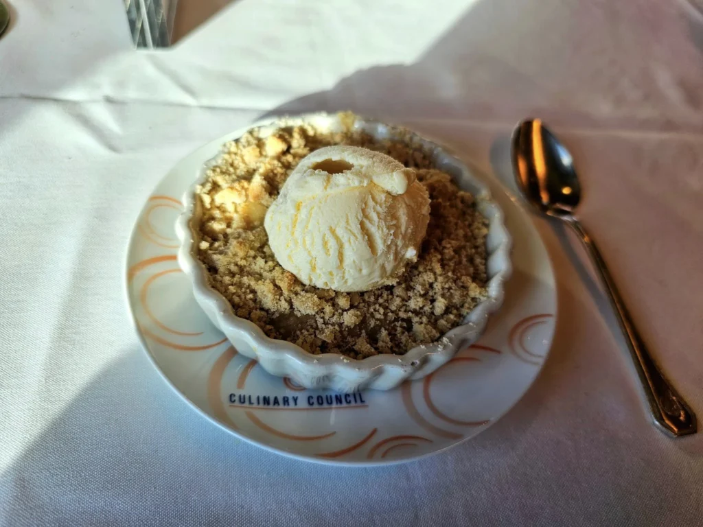 Cruising with Danny and Peter, Holland America Line, Westerdam, Seattle, Washington, United States, Alaska Solstice Cruise | A vibrant scene captures the Holland America Line’s Westerdam docked at Pier 91 in Seattle, Washington, with the iconic Space Needle and bustling Pike Place Market visible in the background, ready for the 28-Day Alaska Arctic Circle Solstice Cruise. The image showcases passengers excitedly boarding the ship, the luxurious stateroom with a spacious balcony offering stunning views of Elliott Bay, and the vessel setting sail from Seattle, marking the start of an unforgettable Alaskan adventure.