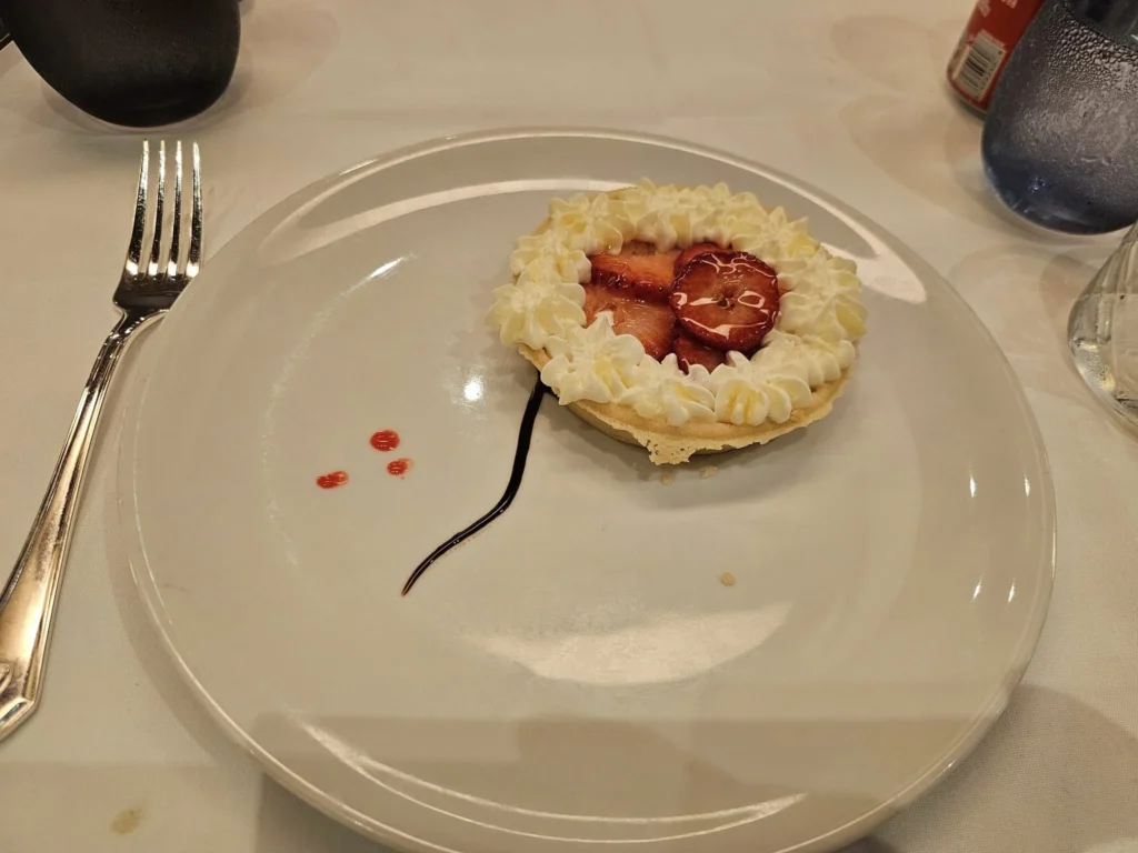 Cruising with Danny and Peter, Holland America Line, Westerdam, Inside Passage, Alaska, United States | Westerdam luxury cruise ship sailing through the Inside Passage, with majestic glaciers and dramatic landscapes in view. The image features an elegant stateroom with a spacious veranda, offering panoramic scenery, and highlights gourmet dining and an informative lecture by onboard naturalists, showcasing the comprehensive luxury and educational experience of the cruise.