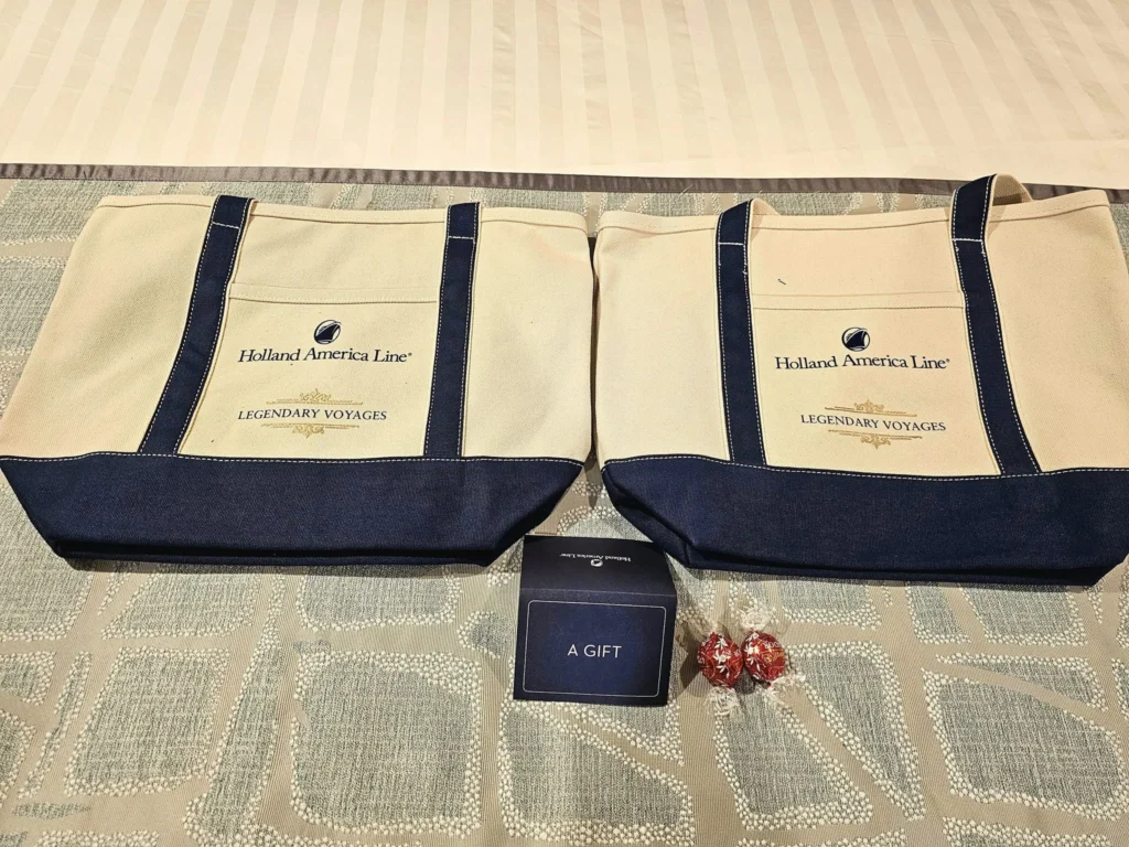 Cruising with Danny and Peter, Holland America Line, Westerdam, Inside Passage, Alaska, United States | Westerdam luxury cruise ship sailing through the Inside Passage, with majestic glaciers and dramatic landscapes in view. The image features an elegant stateroom with a spacious veranda, offering panoramic scenery, and highlights gourmet dining and an informative lecture by onboard naturalists, showcasing the comprehensive luxury and educational experience of the cruise.