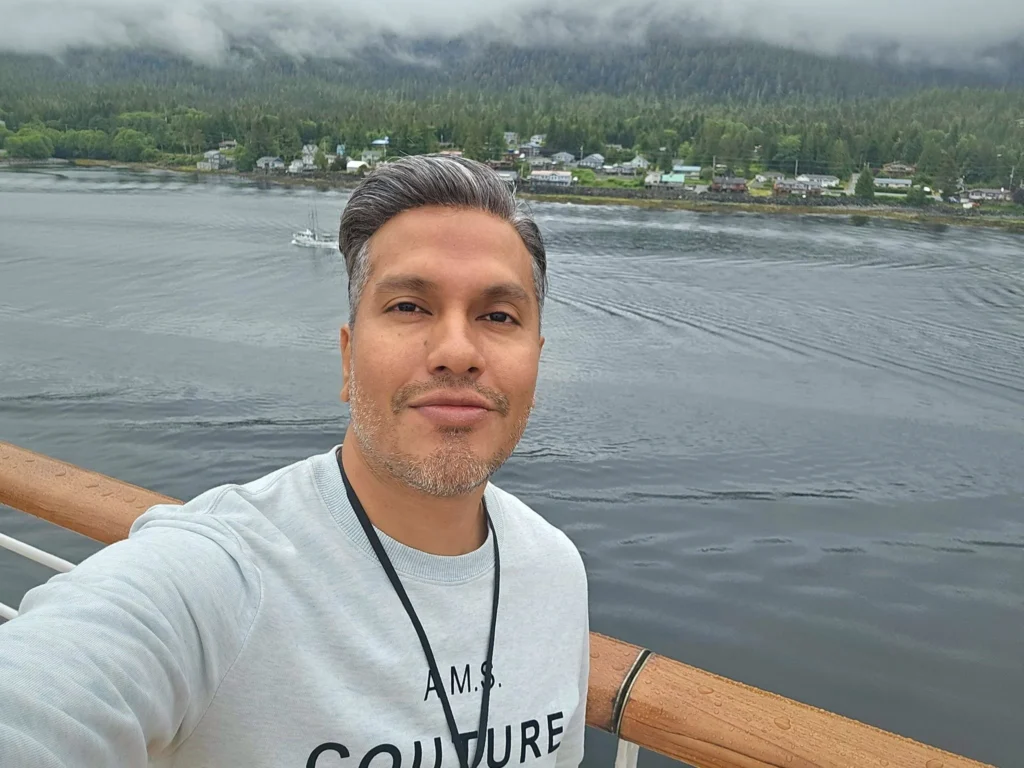 Cruising with Danny and Peter, Holland America Line, Westerdam, Ketchikan, Alaska, United States, Adventure History Thrills | A vibrant collage capturing the Ketchikan Adventure Tour in Alaska, featuring a dynamic log-rolling contest at the Great Alaskan Lumberjack Show with lumberjacks in plaid shirts balancing on a floating log, a rugged UTV navigating a muddy trail through the Tongass National Forest with George Inlet Fjords’ turquoise waters in view, a serene scenic cruise along the Inside Passage with a bald eagle soaring above mist-covered mountains, and a cozy scene at George Inlet Lodge with a rustic table set with craft beers, creamy crab chowder, hot Dungeness crab, and blueberry cheesecake. In the background, Ketchikan’s historic Creek Street showcases colorful buildings on stilts and a Tlingit totem pole, framed by lush greenery and rugged Alaskan peaks, embodying the city’s thrilling adventures and rich cultural heritage.