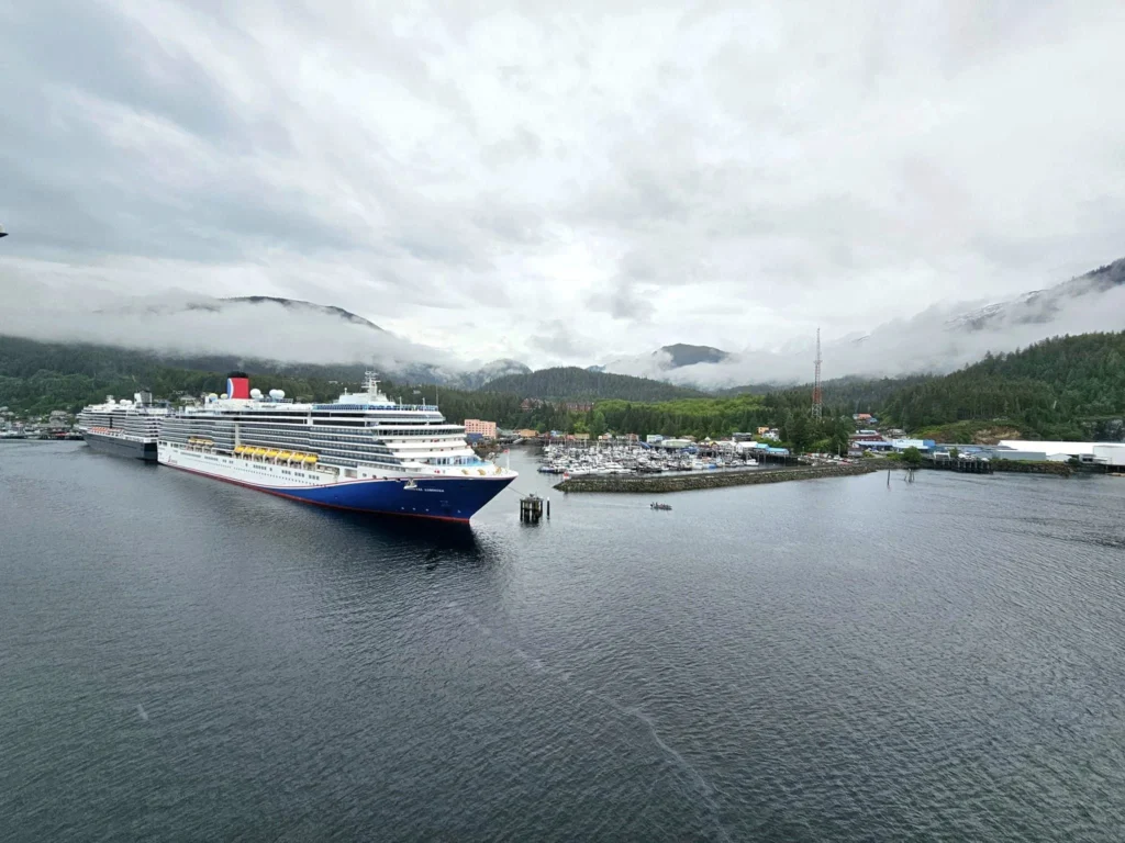 Cruising with Danny and Peter, Holland America Line, Westerdam, Ketchikan, Alaska, United States, Adventure History Thrills | A vibrant collage capturing the Ketchikan Adventure Tour in Alaska, featuring a dynamic log-rolling contest at the Great Alaskan Lumberjack Show with lumberjacks in plaid shirts balancing on a floating log, a rugged UTV navigating a muddy trail through the Tongass National Forest with George Inlet Fjords’ turquoise waters in view, a serene scenic cruise along the Inside Passage with a bald eagle soaring above mist-covered mountains, and a cozy scene at George Inlet Lodge with a rustic table set with craft beers, creamy crab chowder, hot Dungeness crab, and blueberry cheesecake. In the background, Ketchikan’s historic Creek Street showcases colorful buildings on stilts and a Tlingit totem pole, framed by lush greenery and rugged Alaskan peaks, embodying the city’s thrilling adventures and rich cultural heritage.