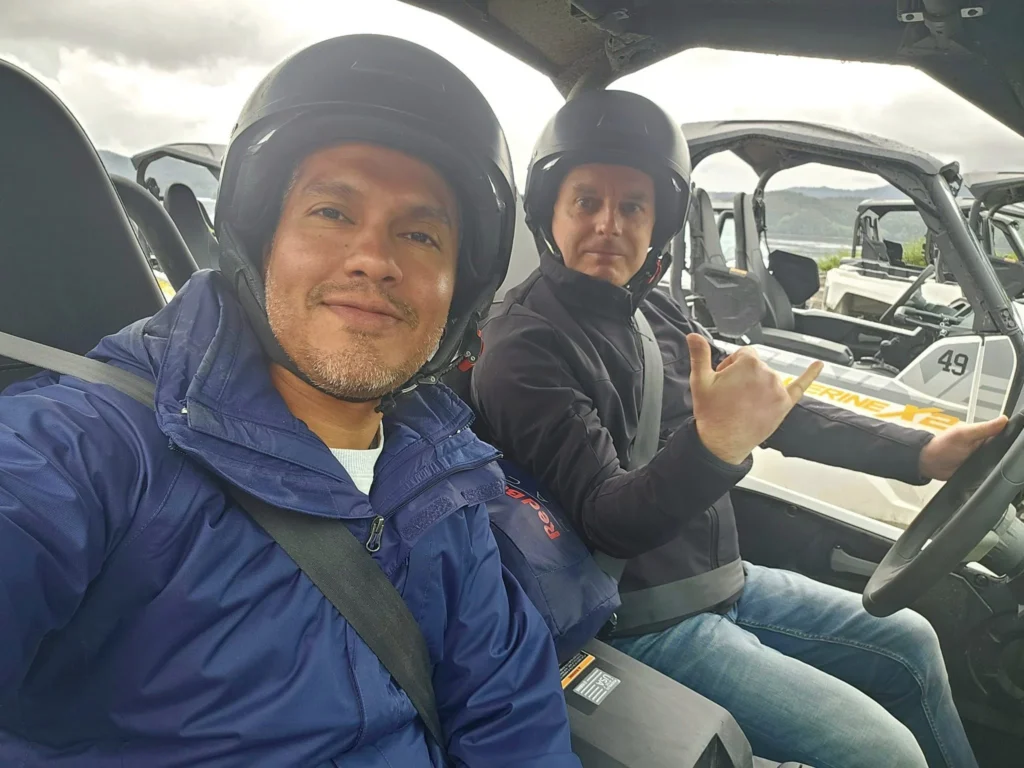 Cruising with Danny and Peter, Holland America Line, Westerdam, Ketchikan, Alaska, United States, Adventure History Thrills | A vibrant collage capturing the Ketchikan Adventure Tour in Alaska, featuring a dynamic log-rolling contest at the Great Alaskan Lumberjack Show with lumberjacks in plaid shirts balancing on a floating log, a rugged UTV navigating a muddy trail through the Tongass National Forest with George Inlet Fjords’ turquoise waters in view, a serene scenic cruise along the Inside Passage with a bald eagle soaring above mist-covered mountains, and a cozy scene at George Inlet Lodge with a rustic table set with craft beers, creamy crab chowder, hot Dungeness crab, and blueberry cheesecake. In the background, Ketchikan’s historic Creek Street showcases colorful buildings on stilts and a Tlingit totem pole, framed by lush greenery and rugged Alaskan peaks, embodying the city’s thrilling adventures and rich cultural heritage.