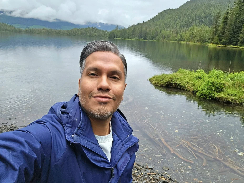 Cruising with Danny and Peter, Holland America Line, Westerdam, Ketchikan, Alaska, United States, Adventure History Thrills | A vibrant collage capturing the Ketchikan Adventure Tour in Alaska, featuring a dynamic log-rolling contest at the Great Alaskan Lumberjack Show with lumberjacks in plaid shirts balancing on a floating log, a rugged UTV navigating a muddy trail through the Tongass National Forest with George Inlet Fjords’ turquoise waters in view, a serene scenic cruise along the Inside Passage with a bald eagle soaring above mist-covered mountains, and a cozy scene at George Inlet Lodge with a rustic table set with craft beers, creamy crab chowder, hot Dungeness crab, and blueberry cheesecake. In the background, Ketchikan’s historic Creek Street showcases colorful buildings on stilts and a Tlingit totem pole, framed by lush greenery and rugged Alaskan peaks, embodying the city’s thrilling adventures and rich cultural heritage.