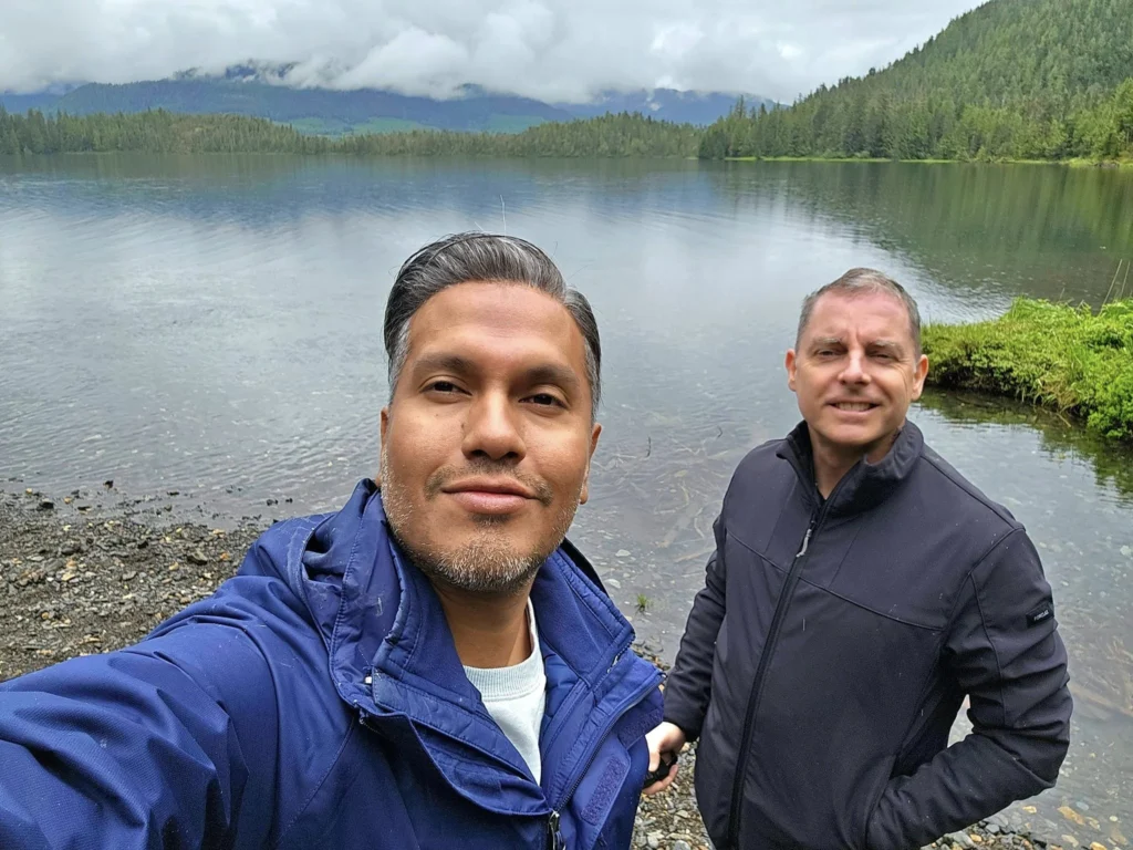 Cruising with Danny and Peter, Holland America Line, Westerdam, Ketchikan, Alaska, United States, Adventure History Thrills | A vibrant collage capturing the Ketchikan Adventure Tour in Alaska, featuring a dynamic log-rolling contest at the Great Alaskan Lumberjack Show with lumberjacks in plaid shirts balancing on a floating log, a rugged UTV navigating a muddy trail through the Tongass National Forest with George Inlet Fjords’ turquoise waters in view, a serene scenic cruise along the Inside Passage with a bald eagle soaring above mist-covered mountains, and a cozy scene at George Inlet Lodge with a rustic table set with craft beers, creamy crab chowder, hot Dungeness crab, and blueberry cheesecake. In the background, Ketchikan’s historic Creek Street showcases colorful buildings on stilts and a Tlingit totem pole, framed by lush greenery and rugged Alaskan peaks, embodying the city’s thrilling adventures and rich cultural heritage.