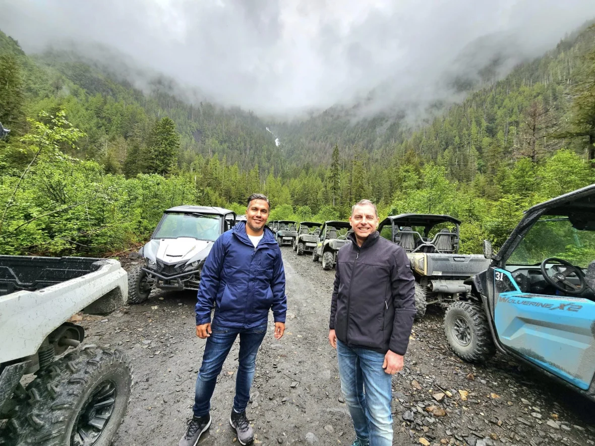 Cruising with Danny and Peter, Holland America Line, Westerdam, Ketchikan, Alaska, United States, Adventure History Thrills | A vibrant collage capturing the Ketchikan Adventure Tour in Alaska, featuring a dynamic log-rolling contest at the Great Alaskan Lumberjack Show with lumberjacks in plaid shirts balancing on a floating log, a rugged UTV navigating a muddy trail through the Tongass National Forest with George Inlet Fjords’ turquoise waters in view, a serene scenic cruise along the Inside Passage with a bald eagle soaring above mist-covered mountains, and a cozy scene at George Inlet Lodge with a rustic table set with craft beers, creamy crab chowder, hot Dungeness crab, and blueberry cheesecake. In the background, Ketchikan’s historic Creek Street showcases colorful buildings on stilts and a Tlingit totem pole, framed by lush greenery and rugged Alaskan peaks, embodying the city’s thrilling adventures and rich cultural heritage.