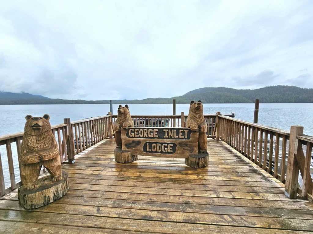 Cruising with Danny and Peter, Holland America Line, Westerdam, Ketchikan, Alaska, United States, Adventure History Thrills | A vibrant collage capturing the Ketchikan Adventure Tour in Alaska, featuring a dynamic log-rolling contest at the Great Alaskan Lumberjack Show with lumberjacks in plaid shirts balancing on a floating log, a rugged UTV navigating a muddy trail through the Tongass National Forest with George Inlet Fjords’ turquoise waters in view, a serene scenic cruise along the Inside Passage with a bald eagle soaring above mist-covered mountains, and a cozy scene at George Inlet Lodge with a rustic table set with craft beers, creamy crab chowder, hot Dungeness crab, and blueberry cheesecake. In the background, Ketchikan’s historic Creek Street showcases colorful buildings on stilts and a Tlingit totem pole, framed by lush greenery and rugged Alaskan peaks, embodying the city’s thrilling adventures and rich cultural heritage.
