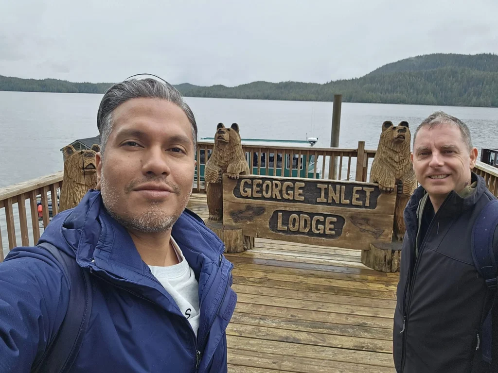 Cruising with Danny and Peter, Holland America Line, Westerdam, Ketchikan, Alaska, United States, Adventure History Thrills | A vibrant collage capturing the Ketchikan Adventure Tour in Alaska, featuring a dynamic log-rolling contest at the Great Alaskan Lumberjack Show with lumberjacks in plaid shirts balancing on a floating log, a rugged UTV navigating a muddy trail through the Tongass National Forest with George Inlet Fjords’ turquoise waters in view, a serene scenic cruise along the Inside Passage with a bald eagle soaring above mist-covered mountains, and a cozy scene at George Inlet Lodge with a rustic table set with craft beers, creamy crab chowder, hot Dungeness crab, and blueberry cheesecake. In the background, Ketchikan’s historic Creek Street showcases colorful buildings on stilts and a Tlingit totem pole, framed by lush greenery and rugged Alaskan peaks, embodying the city’s thrilling adventures and rich cultural heritage.