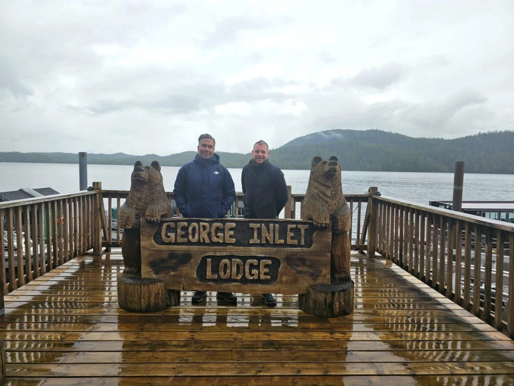 Cruising with Danny and Peter, Holland America Line, Westerdam, Ketchikan, Alaska, United States, Adventure History Thrills | A vibrant collage capturing the Ketchikan Adventure Tour in Alaska, featuring a dynamic log-rolling contest at the Great Alaskan Lumberjack Show with lumberjacks in plaid shirts balancing on a floating log, a rugged UTV navigating a muddy trail through the Tongass National Forest with George Inlet Fjords’ turquoise waters in view, a serene scenic cruise along the Inside Passage with a bald eagle soaring above mist-covered mountains, and a cozy scene at George Inlet Lodge with a rustic table set with craft beers, creamy crab chowder, hot Dungeness crab, and blueberry cheesecake. In the background, Ketchikan’s historic Creek Street showcases colorful buildings on stilts and a Tlingit totem pole, framed by lush greenery and rugged Alaskan peaks, embodying the city’s thrilling adventures and rich cultural heritage.