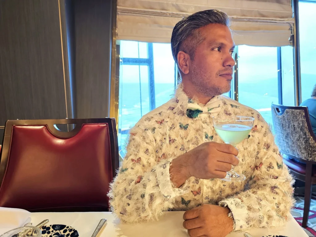 Cruising with Danny and Peter, Holland America Line, Westerdam, Ketchikan, Alaska, United States, Adventure History Thrills | A vibrant collage capturing the Ketchikan Adventure Tour in Alaska, featuring a dynamic log-rolling contest at the Great Alaskan Lumberjack Show with lumberjacks in plaid shirts balancing on a floating log, a rugged UTV navigating a muddy trail through the Tongass National Forest with George Inlet Fjords’ turquoise waters in view, a serene scenic cruise along the Inside Passage with a bald eagle soaring above mist-covered mountains, and a cozy scene at George Inlet Lodge with a rustic table set with craft beers, creamy crab chowder, hot Dungeness crab, and blueberry cheesecake. In the background, Ketchikan’s historic Creek Street showcases colorful buildings on stilts and a Tlingit totem pole, framed by lush greenery and rugged Alaskan peaks, embodying the city’s thrilling adventures and rich cultural heritage.