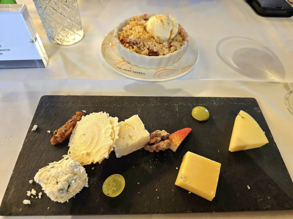 Cruising with Danny and Peter, Holland America Line, Westerdam, Ketchikan, Alaska, United States, Adventure History Thrills | A vibrant collage capturing the Ketchikan Adventure Tour in Alaska, featuring a dynamic log-rolling contest at the Great Alaskan Lumberjack Show with lumberjacks in plaid shirts balancing on a floating log, a rugged UTV navigating a muddy trail through the Tongass National Forest with George Inlet Fjords’ turquoise waters in view, a serene scenic cruise along the Inside Passage with a bald eagle soaring above mist-covered mountains, and a cozy scene at George Inlet Lodge with a rustic table set with craft beers, creamy crab chowder, hot Dungeness crab, and blueberry cheesecake. In the background, Ketchikan’s historic Creek Street showcases colorful buildings on stilts and a Tlingit totem pole, framed by lush greenery and rugged Alaskan peaks, embodying the city’s thrilling adventures and rich cultural heritage.