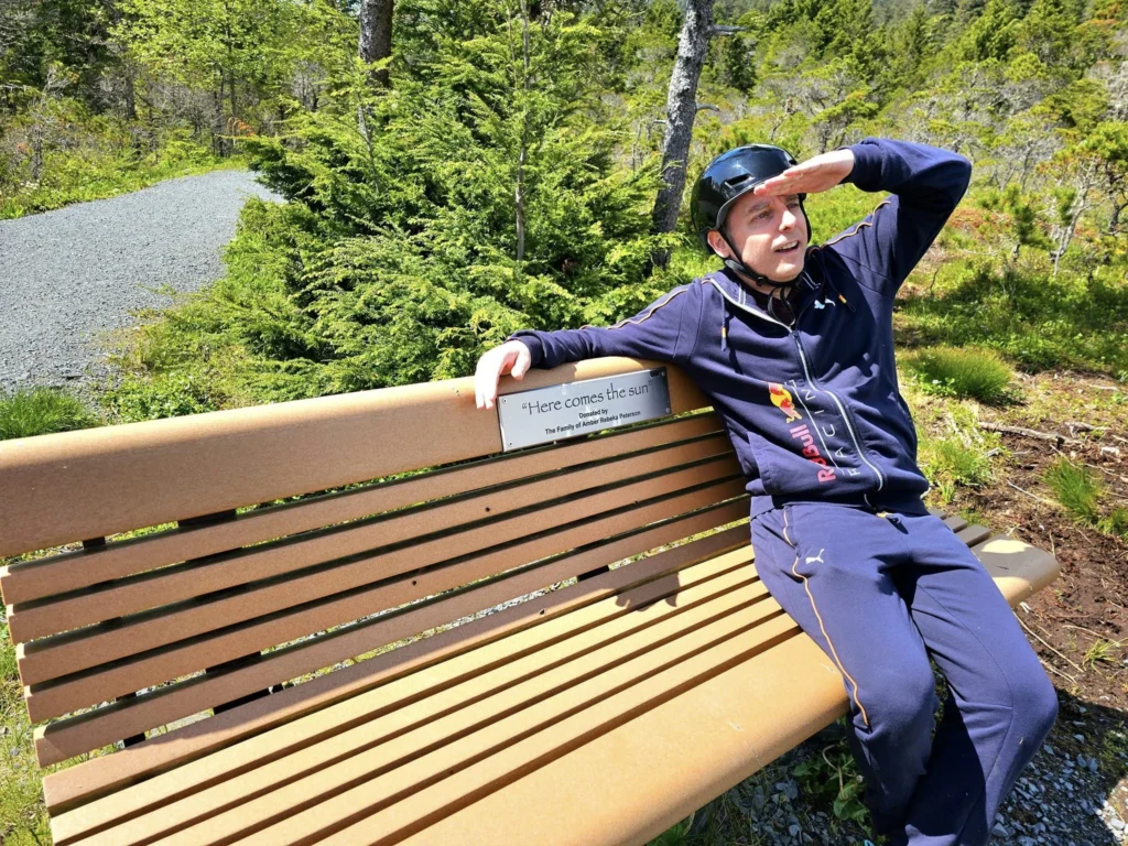 Cruising with Danny and Peter, Holland America Line, Westerdam, Sitka, Alaska, United States | Biking the scenic Sitka Cross Trail through lush Alaskan forests, capturing Sitka's natural beauty and outdoor adventure; a whale breaching in Whale Park, showcasing Sitka Alaska's wildlife; a majestic eagle soaring above, symbolizing the rich wildlife; and an intricate Tlingit totem pole representing the cultural heritage of Sitka, Alaska, all set against the stunning coastal landscape of this Alaskan gem.