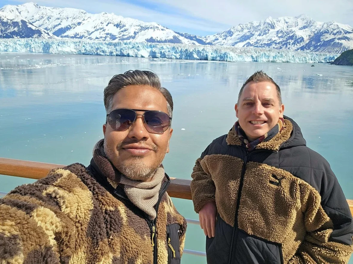 Cruising with Danny and Peter, Holland America Line, Westerdam, Hubbard Glacier, Alaska, United States | View of Hubbard Glacier from the boat during an unforgettable tour, showcasing stunning blue ice and calm Arctic waters. Thrilling ice calving event captures large chunks of ice breaking off and crashing into the water. Mirror-like reflection of the glacier on still waters highlights its majestic blue hues. A delightful picnic with the glacier in the background combines delicious food with breathtaking views, while a close-up of the glacier's intricate ice formations shows deep crevasses and jagged edges.