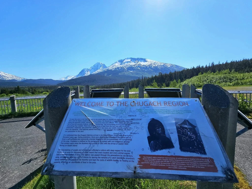 Cruising with Danny and Peter, Holland America Line, Westerdam, Seward, Alaska, United States | A panoramic view of Seward Harbor with rugged cliffs and serene waters, capturing Alaska's wilderness on a photography adventure. Travelers document vibrant wildflowers and snow-capped peaks in Chugach National Forest during an Alaska wilderness cruise. Historical remnants of the 1890 Gold Rush in Seward, including old mining equipment in lush alpine meadows, offer perfect scenes for photography enthusiasts. A majestic bald eagle soars over the tranquil waters of Seward Harbor, while senior-friendly guided tours explore accessible trails amidst stunning natural landscapes.