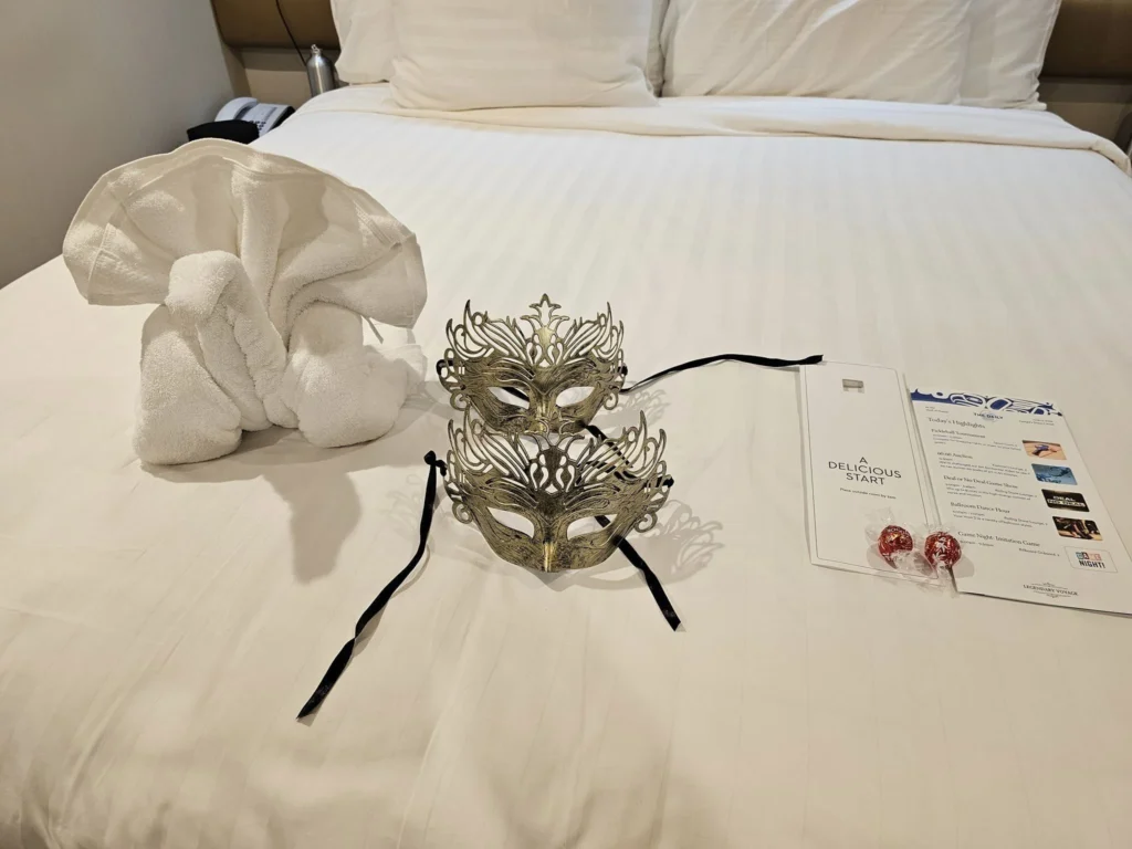 Cruising with Danny and Peter, Holland America Line, Westerdam, Seward, Alaska, United States | A panoramic view of Seward Harbor with rugged cliffs and serene waters, capturing Alaska's wilderness on a photography adventure. Travelers document vibrant wildflowers and snow-capped peaks in Chugach National Forest during an Alaska wilderness cruise. Historical remnants of the 1890 Gold Rush in Seward, including old mining equipment in lush alpine meadows, offer perfect scenes for photography enthusiasts. A majestic bald eagle soars over the tranquil waters of Seward Harbor, while senior-friendly guided tours explore accessible trails amidst stunning natural landscapes.