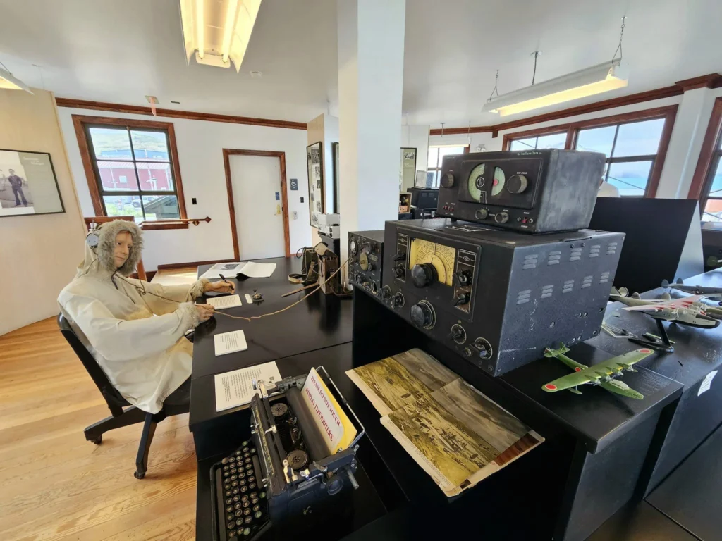 Cruising with Danny and Peter, Holland America Line, Westerdam, Dutch Harbor, Unlaska, Alaska, United States | Scenic view of Dutch Harbor Unalaska featuring rugged mountains and the Bering Sea, with a hiker on Mount Ballyhoo Trail, a majestic bald eagle soaring above, and the historic Russian Orthodox Church with its distinctive onion domes. Includes a fresh seafood dish representing local cuisine and a birdwatching spot at Unalaska Island Bird Sanctuary, capturing the charm of Unalaska's blend of natural beauty, wildlife, and cultural heritage.