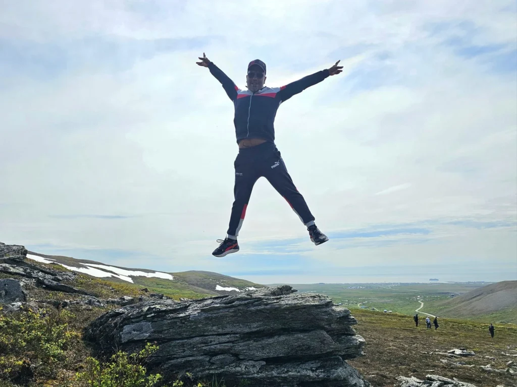 Discovering Newton Peak Hike in Nome, Alaska: A Comprehensive Adventure Guide 11 Cruising with Danny and Peter, Holland America Line, Westerdam, Nome, Alaska, United States | Scenic images of the Newton Peak Hike in Nome, Alaska, including the trailhead marking the start of the adventure, hikers ascending the challenging terrain, panoramic summit views of rolling hills and the Bering Sea, wildlife like curious squirrels and soaring birds along the trail, and vibrant wildflowers adding color to the rugged landscape.