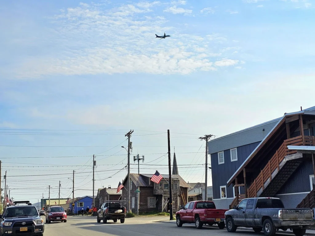 Discovering Newton Peak Hike in Nome, Alaska: A Comprehensive Adventure Guide 17 Cruising with Danny and Peter, Holland America Line, Westerdam, Nome, Alaska, United States | Scenic images of the Newton Peak Hike in Nome, Alaska, including the trailhead marking the start of the adventure, hikers ascending the challenging terrain, panoramic summit views of rolling hills and the Bering Sea, wildlife like curious squirrels and soaring birds along the trail, and vibrant wildflowers adding color to the rugged landscape.
