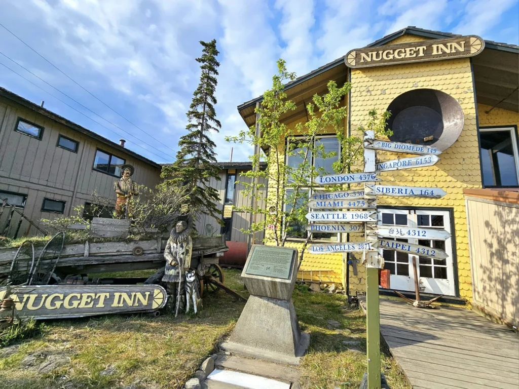 Discovering Newton Peak Hike in Nome, Alaska: A Comprehensive Adventure Guide 18 Cruising with Danny and Peter, Holland America Line, Westerdam, Nome, Alaska, United States | Scenic images of the Newton Peak Hike in Nome, Alaska, including the trailhead marking the start of the adventure, hikers ascending the challenging terrain, panoramic summit views of rolling hills and the Bering Sea, wildlife like curious squirrels and soaring birds along the trail, and vibrant wildflowers adding color to the rugged landscape.