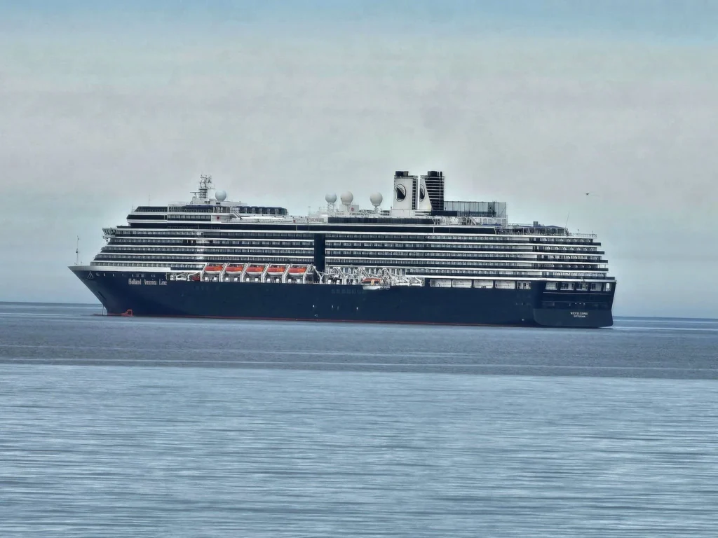 Discovering Newton Peak Hike in Nome, Alaska: A Comprehensive Adventure Guide 27 Cruising with Danny and Peter, Holland America Line, Westerdam, Nome, Alaska, United States | Scenic images of the Newton Peak Hike in Nome, Alaska, including the trailhead marking the start of the adventure, hikers ascending the challenging terrain, panoramic summit views of rolling hills and the Bering Sea, wildlife like curious squirrels and soaring birds along the trail, and vibrant wildflowers adding color to the rugged landscape.