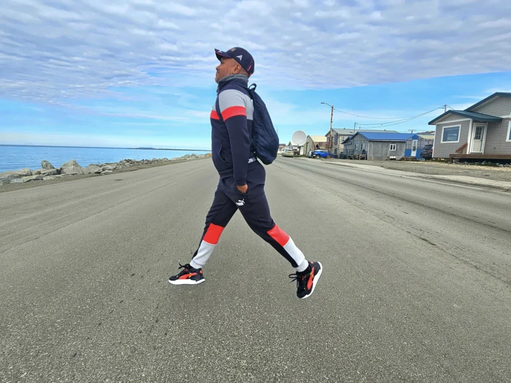 Discovering Newton Peak Hike in Nome, Alaska: A Comprehensive Adventure Guide 30 Cruising with Danny and Peter, Holland America Line, Westerdam, Nome, Alaska, United States | Scenic images of the Newton Peak Hike in Nome, Alaska, including the trailhead marking the start of the adventure, hikers ascending the challenging terrain, panoramic summit views of rolling hills and the Bering Sea, wildlife like curious squirrels and soaring birds along the trail, and vibrant wildflowers adding color to the rugged landscape.