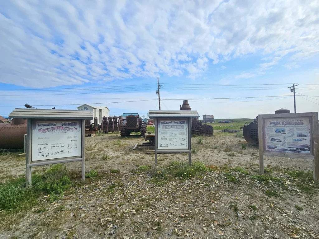 Discovering Newton Peak Hike in Nome, Alaska: A Comprehensive Adventure Guide 31 Cruising with Danny and Peter, Holland America Line, Westerdam, Nome, Alaska, United States | Scenic images of the Newton Peak Hike in Nome, Alaska, including the trailhead marking the start of the adventure, hikers ascending the challenging terrain, panoramic summit views of rolling hills and the Bering Sea, wildlife like curious squirrels and soaring birds along the trail, and vibrant wildflowers adding color to the rugged landscape.