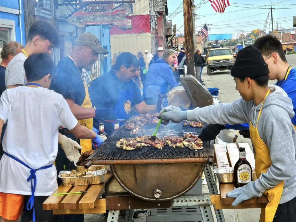Discovering Newton Peak Hike in Nome, Alaska: A Comprehensive Adventure Guide 33 Cruising with Danny and Peter, Holland America Line, Westerdam, Nome, Alaska, United States | Scenic images of the Newton Peak Hike in Nome, Alaska, including the trailhead marking the start of the adventure, hikers ascending the challenging terrain, panoramic summit views of rolling hills and the Bering Sea, wildlife like curious squirrels and soaring birds along the trail, and vibrant wildflowers adding color to the rugged landscape.