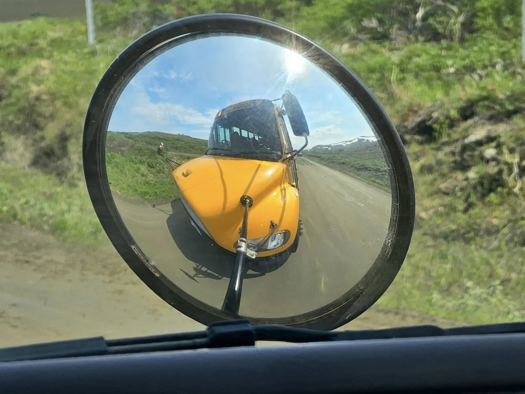 Discovering Newton Peak Hike in Nome, Alaska: A Comprehensive Adventure Guide 48 Cruising with Danny and Peter, Holland America Line, Westerdam, Nome, Alaska, United States | Scenic images of the Newton Peak Hike in Nome, Alaska, including the trailhead marking the start of the adventure, hikers ascending the challenging terrain, panoramic summit views of rolling hills and the Bering Sea, wildlife like curious squirrels and soaring birds along the trail, and vibrant wildflowers adding color to the rugged landscape.