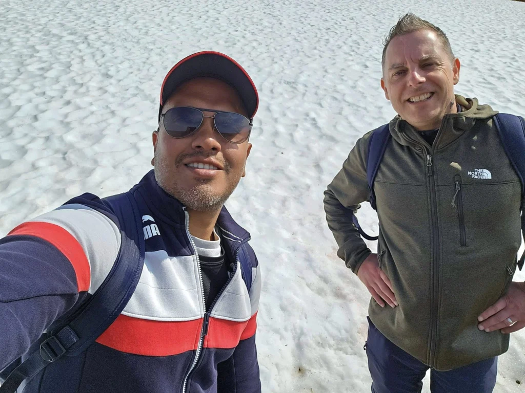 Discovering Newton Peak Hike in Nome, Alaska: A Comprehensive Adventure Guide 60 Cruising with Danny and Peter, Holland America Line, Westerdam, Nome, Alaska, United States | Scenic images of the Newton Peak Hike in Nome, Alaska, including the trailhead marking the start of the adventure, hikers ascending the challenging terrain, panoramic summit views of rolling hills and the Bering Sea, wildlife like curious squirrels and soaring birds along the trail, and vibrant wildflowers adding color to the rugged landscape.