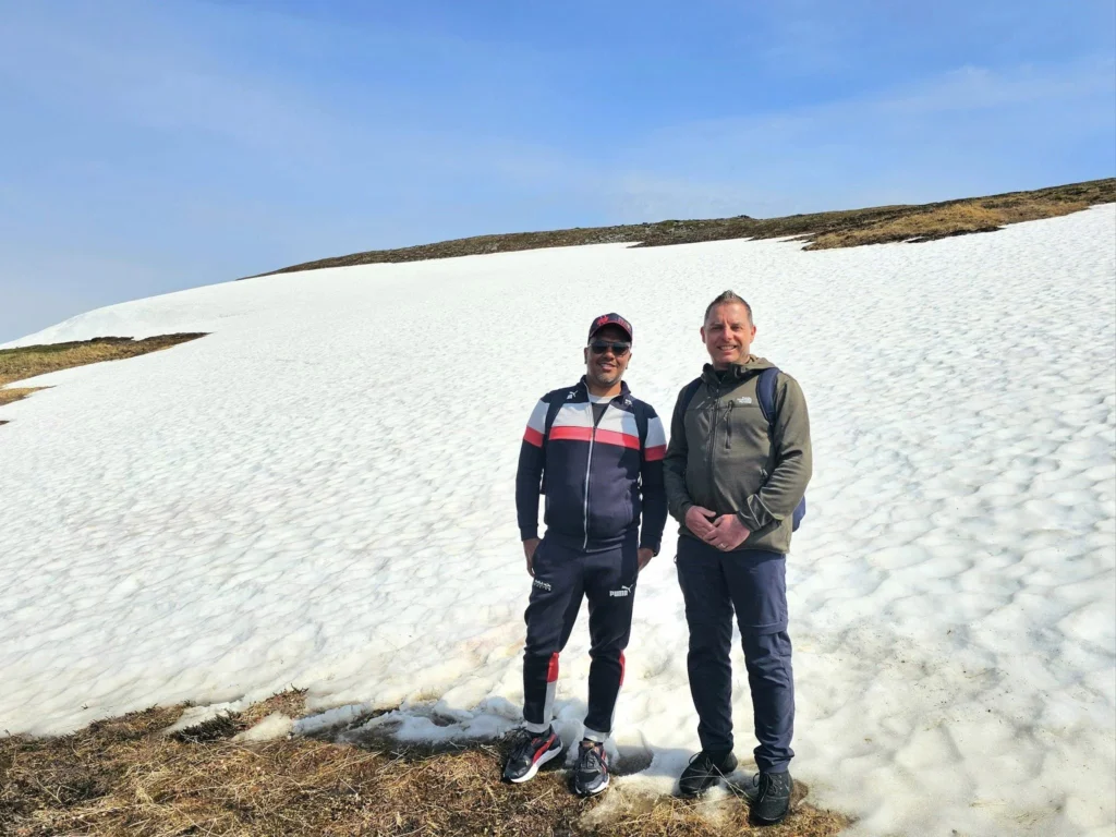 Discovering Newton Peak Hike in Nome, Alaska: A Comprehensive Adventure Guide 61 Cruising with Danny and Peter, Holland America Line, Westerdam, Nome, Alaska, United States | Scenic images of the Newton Peak Hike in Nome, Alaska, including the trailhead marking the start of the adventure, hikers ascending the challenging terrain, panoramic summit views of rolling hills and the Bering Sea, wildlife like curious squirrels and soaring birds along the trail, and vibrant wildflowers adding color to the rugged landscape.