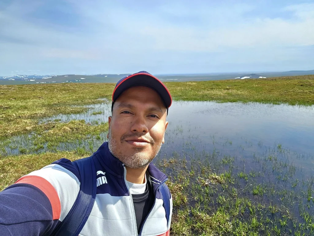 Discovering Newton Peak Hike in Nome, Alaska: A Comprehensive Adventure Guide 64 Cruising with Danny and Peter, Holland America Line, Westerdam, Nome, Alaska, United States | Scenic images of the Newton Peak Hike in Nome, Alaska, including the trailhead marking the start of the adventure, hikers ascending the challenging terrain, panoramic summit views of rolling hills and the Bering Sea, wildlife like curious squirrels and soaring birds along the trail, and vibrant wildflowers adding color to the rugged landscape.