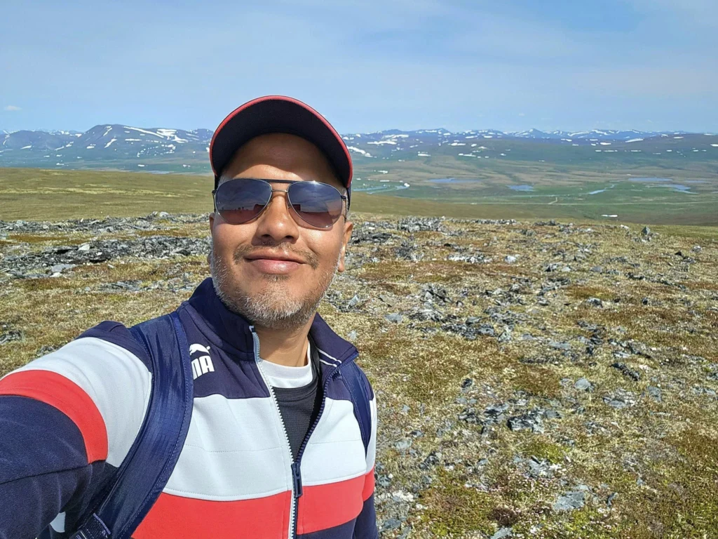 Discovering Newton Peak Hike in Nome, Alaska: A Comprehensive Adventure Guide 67 Cruising with Danny and Peter, Holland America Line, Westerdam, Nome, Alaska, United States | Scenic images of the Newton Peak Hike in Nome, Alaska, including the trailhead marking the start of the adventure, hikers ascending the challenging terrain, panoramic summit views of rolling hills and the Bering Sea, wildlife like curious squirrels and soaring birds along the trail, and vibrant wildflowers adding color to the rugged landscape.