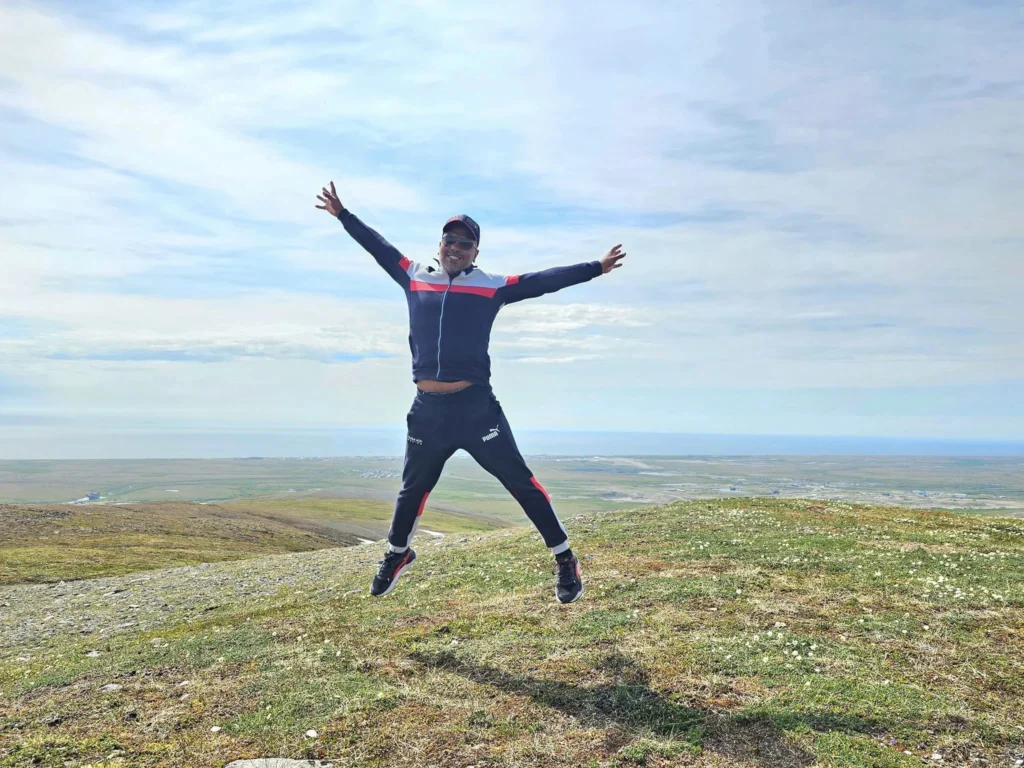 Discovering Newton Peak Hike in Nome, Alaska: A Comprehensive Adventure Guide 70 Cruising with Danny and Peter, Holland America Line, Westerdam, Nome, Alaska, United States | Scenic images of the Newton Peak Hike in Nome, Alaska, including the trailhead marking the start of the adventure, hikers ascending the challenging terrain, panoramic summit views of rolling hills and the Bering Sea, wildlife like curious squirrels and soaring birds along the trail, and vibrant wildflowers adding color to the rugged landscape.