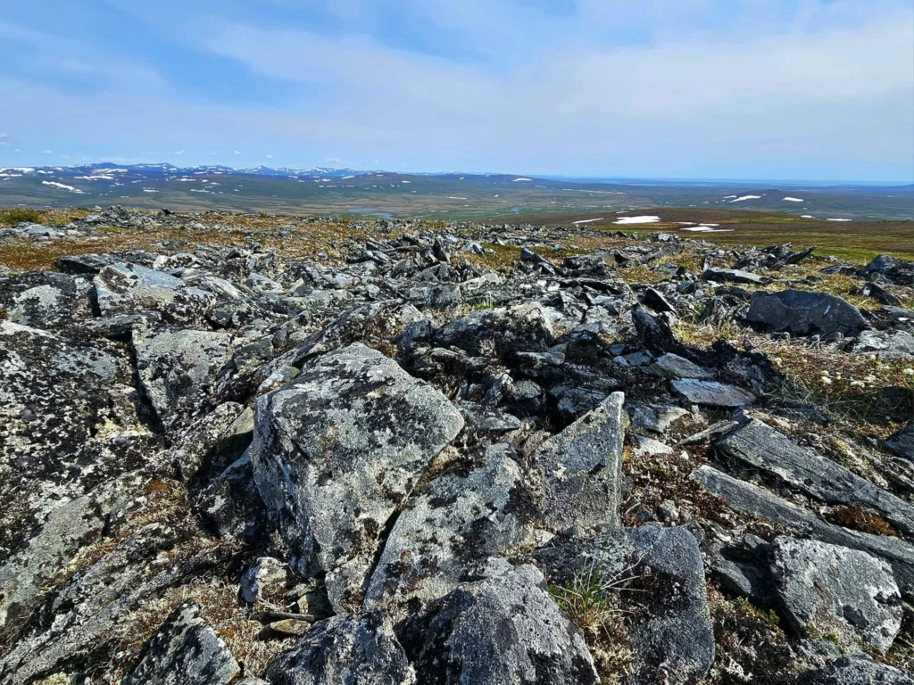 Discovering Newton Peak Hike in Nome, Alaska: A Comprehensive Adventure Guide 71 Cruising with Danny and Peter, Holland America Line, Westerdam, Nome, Alaska, United States | Scenic images of the Newton Peak Hike in Nome, Alaska, including the trailhead marking the start of the adventure, hikers ascending the challenging terrain, panoramic summit views of rolling hills and the Bering Sea, wildlife like curious squirrels and soaring birds along the trail, and vibrant wildflowers adding color to the rugged landscape.