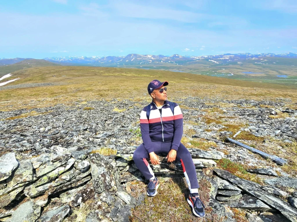 Discovering Newton Peak Hike in Nome, Alaska: A Comprehensive Adventure Guide 7 Cruising with Danny and Peter, Holland America Line, Westerdam, Nome, Alaska, United States | Scenic images of the Newton Peak Hike in Nome, Alaska, including the trailhead marking the start of the adventure, hikers ascending the challenging terrain, panoramic summit views of rolling hills and the Bering Sea, wildlife like curious squirrels and soaring birds along the trail, and vibrant wildflowers adding color to the rugged landscape.