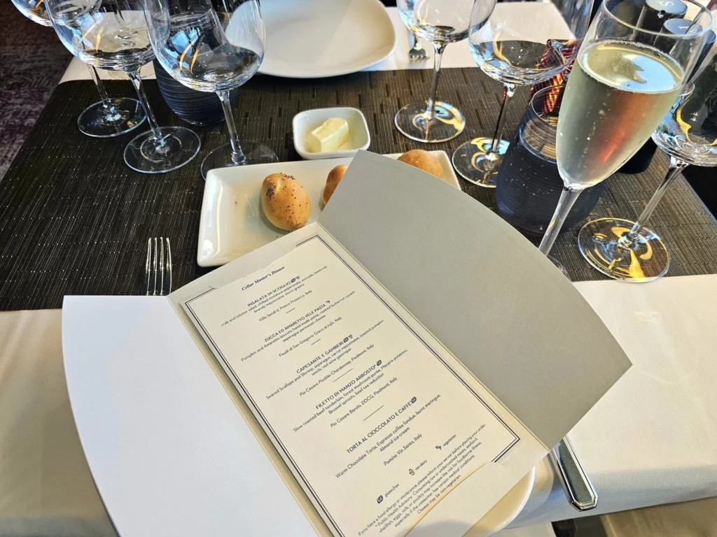 Cruising with Danny and Peter, Holland America Line, Westerdam, Unimak Passage, Alaska, United States | Elegant setting of the Canaletto restaurant on the Holland America Line Westerdam, featuring exquisite dishes such as crab and lobster salad, hand-made pumpkin pasta, seared scallops and shrimp, slow-roasted beef tenderloin, and warm chocolate torta, each paired with exceptional wines like Villa Sandi iL Presco Prosecco, Feudi di San Gregorio Greco di Tufo, Pio Cesare Piodilei Chardonnay, and Pio Cesare Barolo, showcasing the ultimate fine dining experience on the luxury cruise.