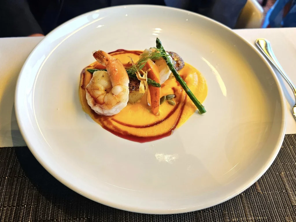 Cruising with Danny and Peter, Holland America Line, Westerdam, Unimak Passage, Alaska, United States | Elegant setting of the Canaletto restaurant on the Holland America Line Westerdam, featuring exquisite dishes such as crab and lobster salad, hand-made pumpkin pasta, seared scallops and shrimp, slow-roasted beef tenderloin, and warm chocolate torta, each paired with exceptional wines like Villa Sandi iL Presco Prosecco, Feudi di San Gregorio Greco di Tufo, Pio Cesare Piodilei Chardonnay, and Pio Cesare Barolo, showcasing the ultimate fine dining experience on the luxury cruise.