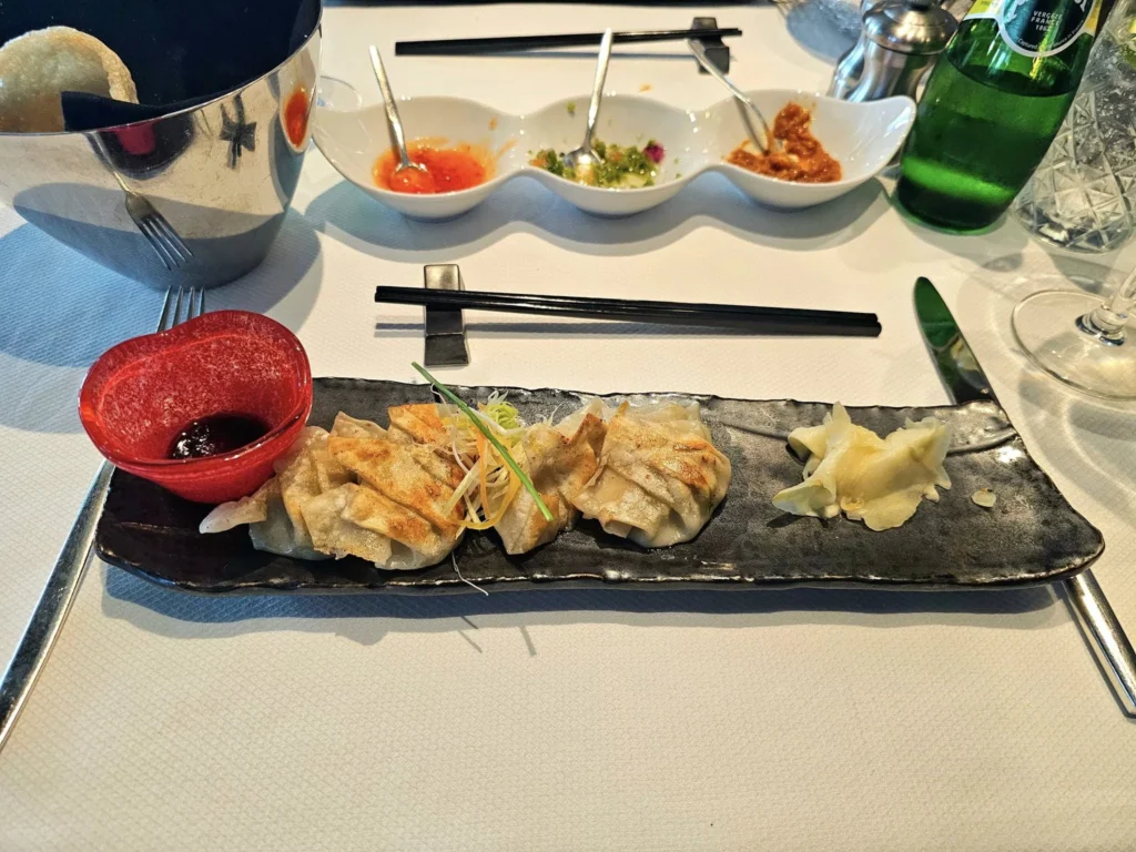 Cruising with Danny and Peter, Holland America Line, Westerdam, Kodiak, Alaska, United States | Explore Fort Abercrombie State Historical Park in Kodiak, Alaska, with views of WWII coastal defense remnants, the Observation Tower, and scenic Piedmont Point. Experience an exquisite dinner at Tamarind in the Pinnacle Grill aboard an Alaska Arctic Circle Solstice cruise, featuring Asian-inspired cuisine.